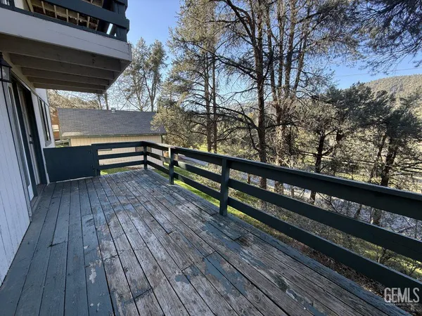 a spacious bedroom with a bed and a couch