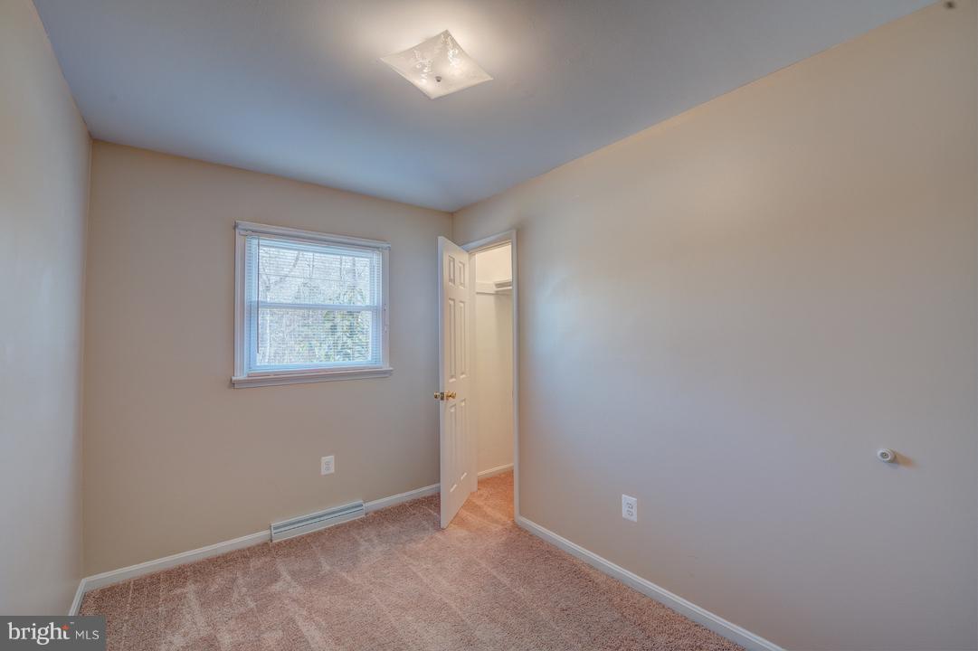 10605 Willetts Crossing Road White Plains, MD 20695 - Photo 16 of 22 an empty room with windows