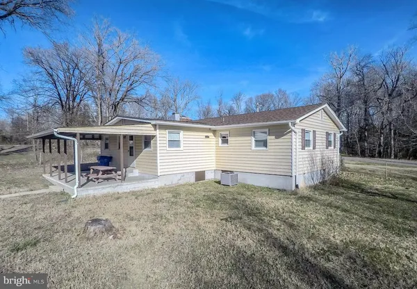 a view of swimming pool with a sitting area