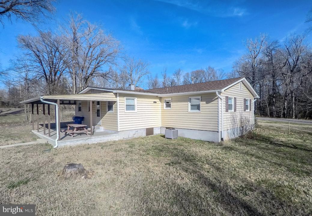 10605 Willetts Crossing Road White Plains, MD 20695 - Photo 18 of 22 a view of a house with a yard