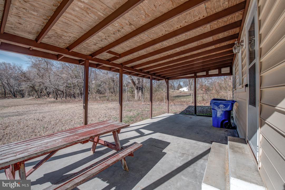10605 Willetts Crossing Road White Plains, MD 20695 - Photo 19 of 22 a view of swimming pool with a sitting area