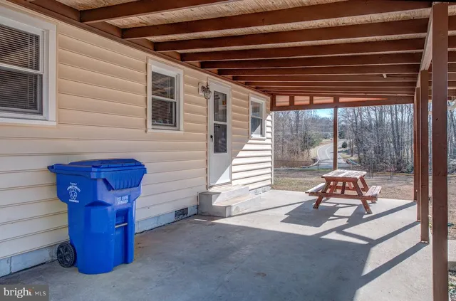 a view of dirt yard with trees