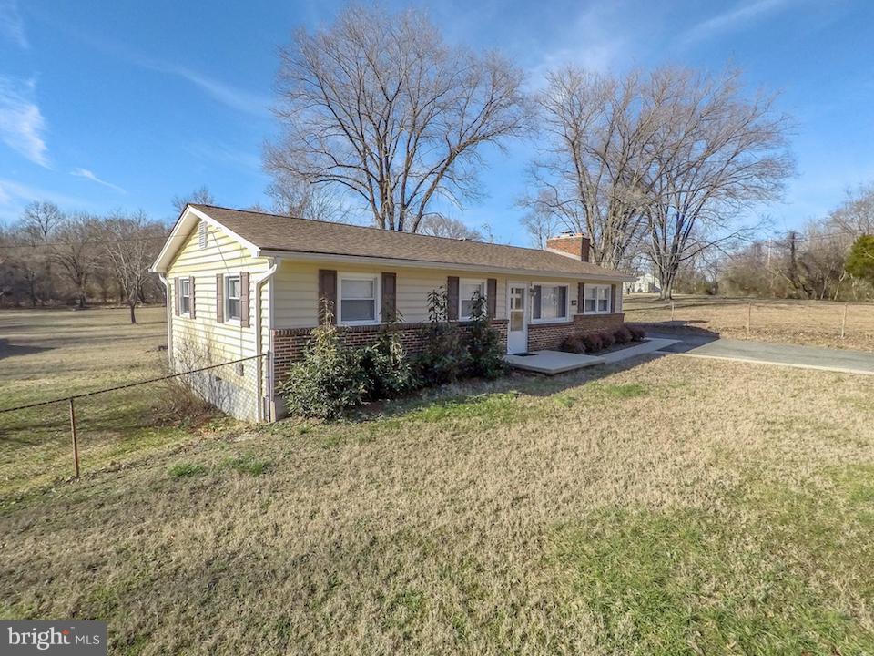 10605 Willetts Crossing Road White Plains, MD 20695 - Photo 22 of 22 a view of a house with a yard