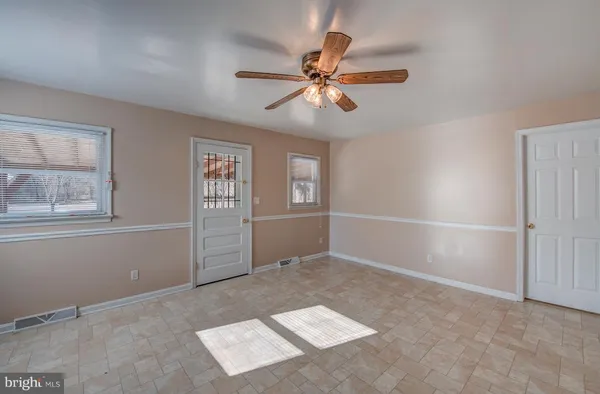 a view of an empty room with a window