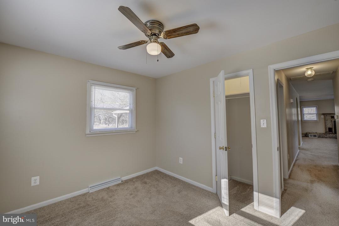 10605 Willetts Crossing Road White Plains, MD 20695 - Photo 9 of 22 a view of a livingroom with a ceiling fan and window