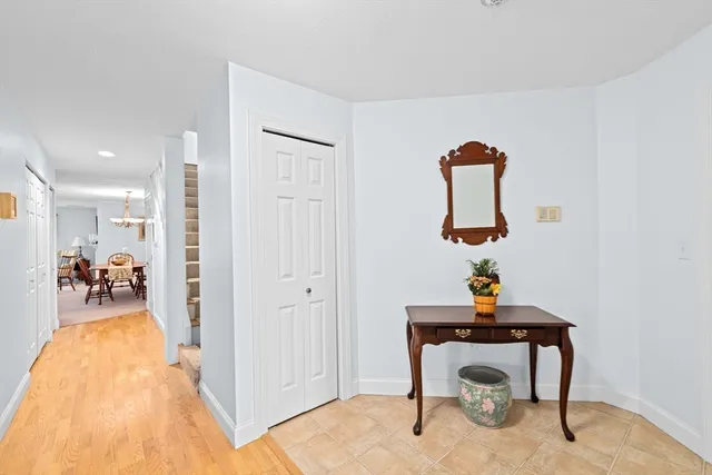 a view of a room with a dining table chairs and entryway