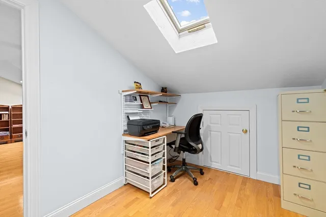 a bedroom with a workspace