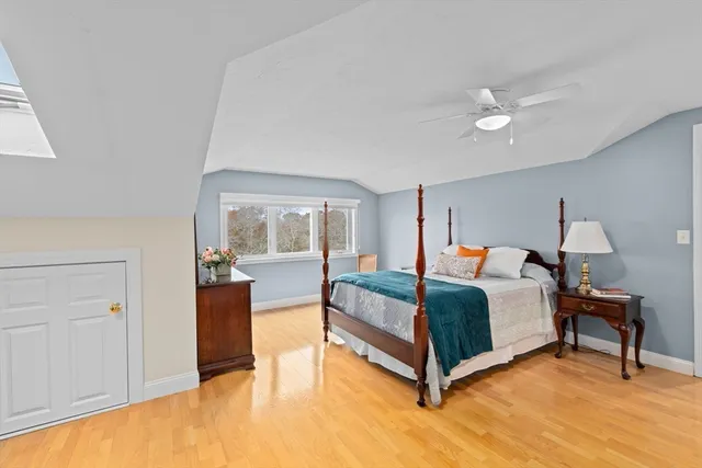 a spacious bedroom with a bed and window