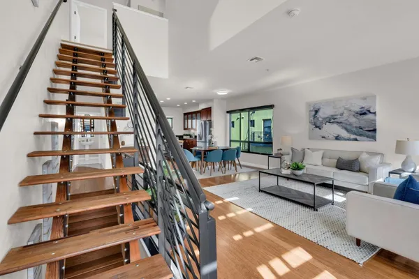 a bathroom with a sink a toilet a mirror a bathtub and shower