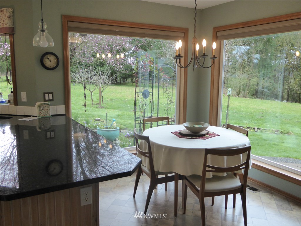 9527 Gastaeson Lane Southwest Rochester, WA 98579 - Photo 12 of 40 a view of a dining room with furniture window and outside view