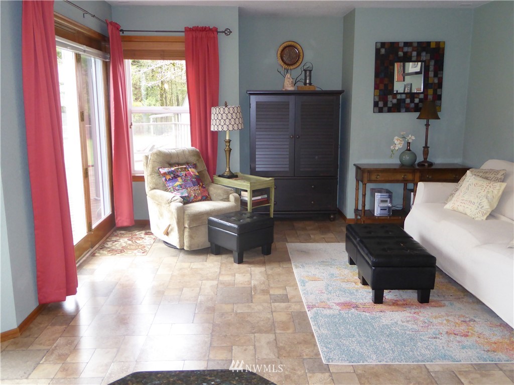 9527 Gastaeson Lane Southwest Rochester, WA 98579 - Photo 13 of 40 a living room with furniture and a window