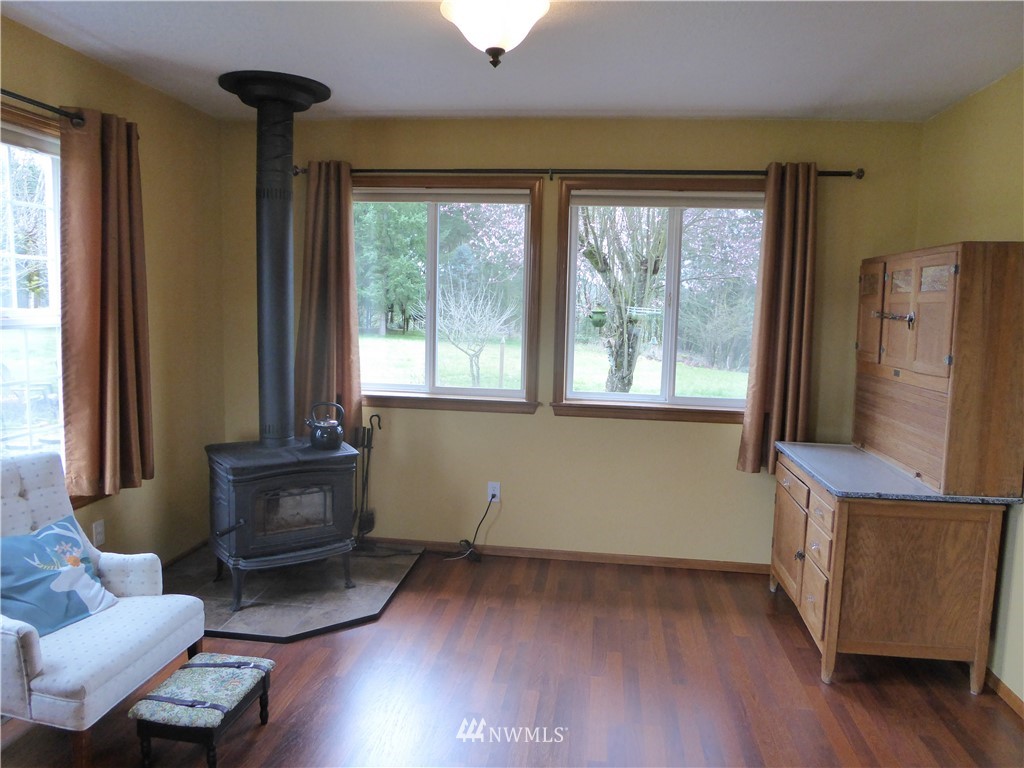 9527 Gastaeson Lane Southwest Rochester, WA 98579 - Photo 14 of 40 a living room with furniture and a window