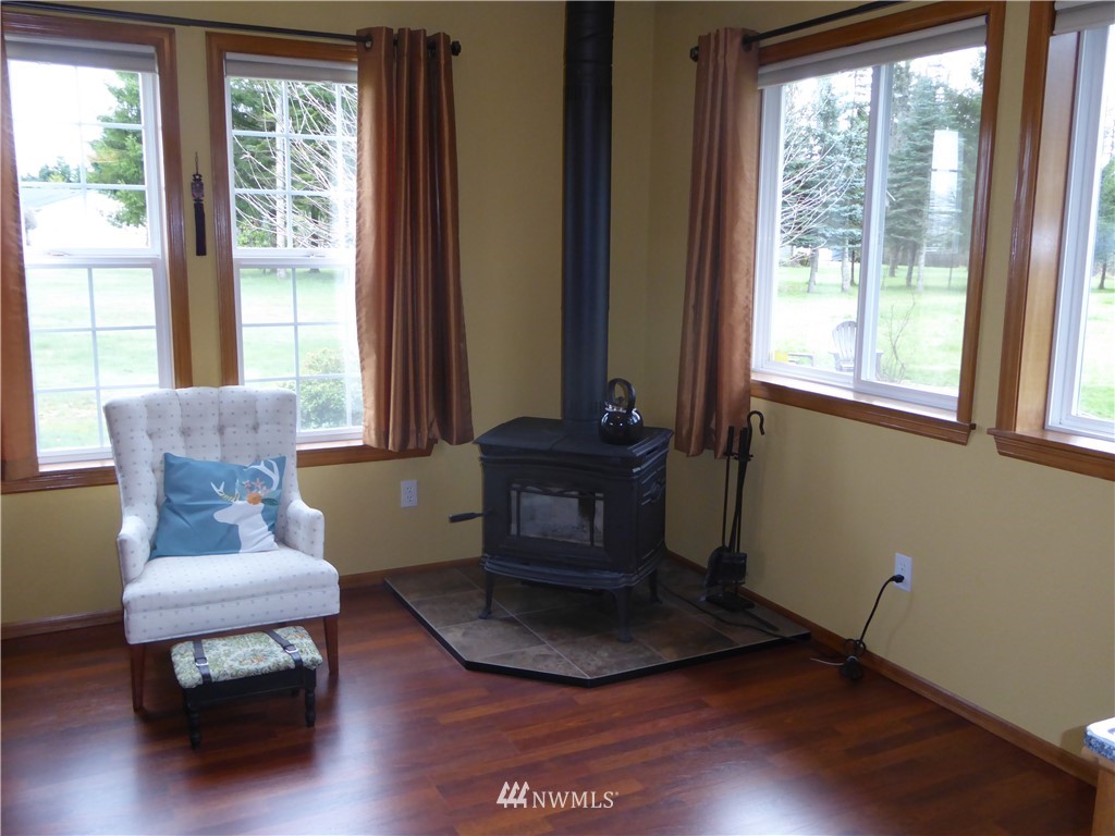 9527 Gastaeson Lane Southwest Rochester, WA 98579 - Photo 15 of 40 a living room with furniture and a window