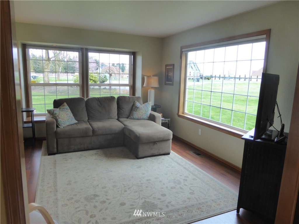 9527 Gastaeson Lane Southwest Rochester, WA 98579 - Photo 17 of 40 a living room with furniture and a flat screen tv