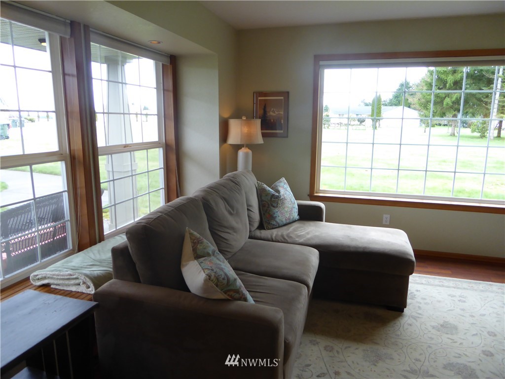 9527 Gastaeson Lane Southwest Rochester, WA 98579 - Photo 18 of 40 a living room with furniture and a window
