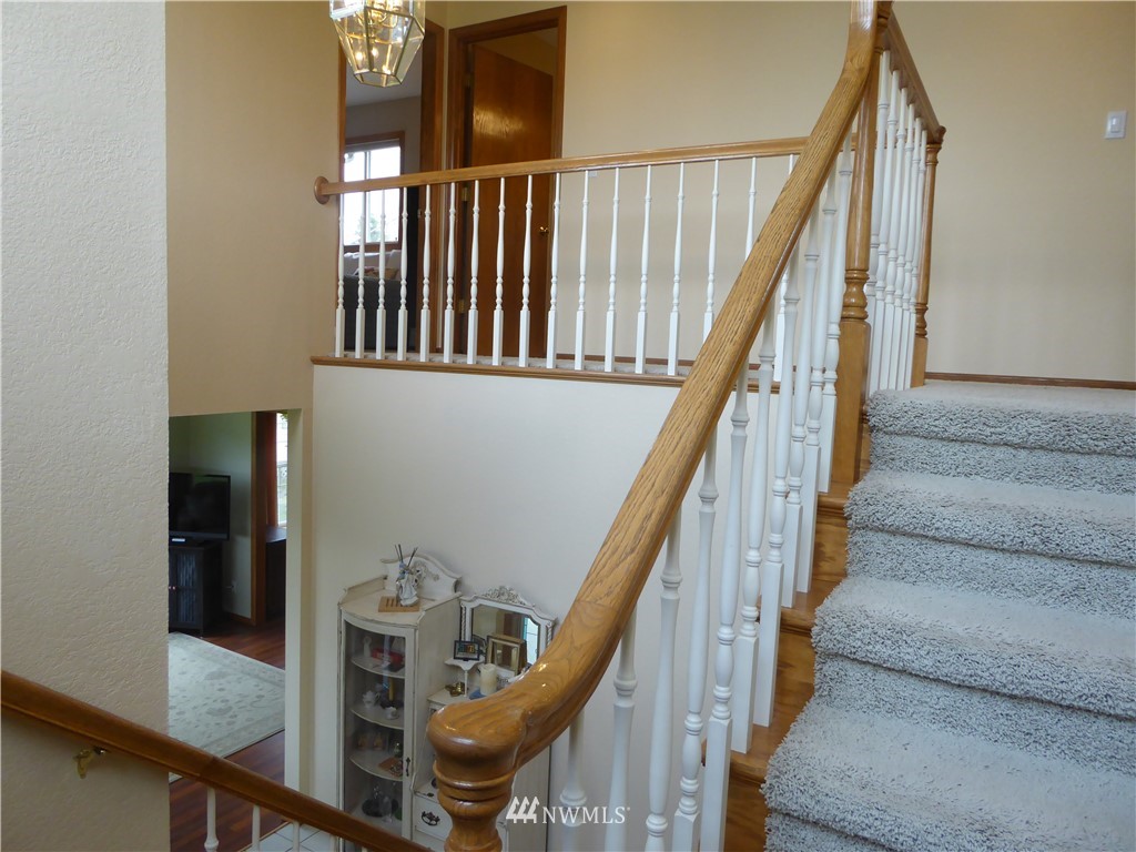 9527 Gastaeson Lane Southwest Rochester, WA 98579 - Photo 21 of 40 a view of entryway and hall with wooden floor