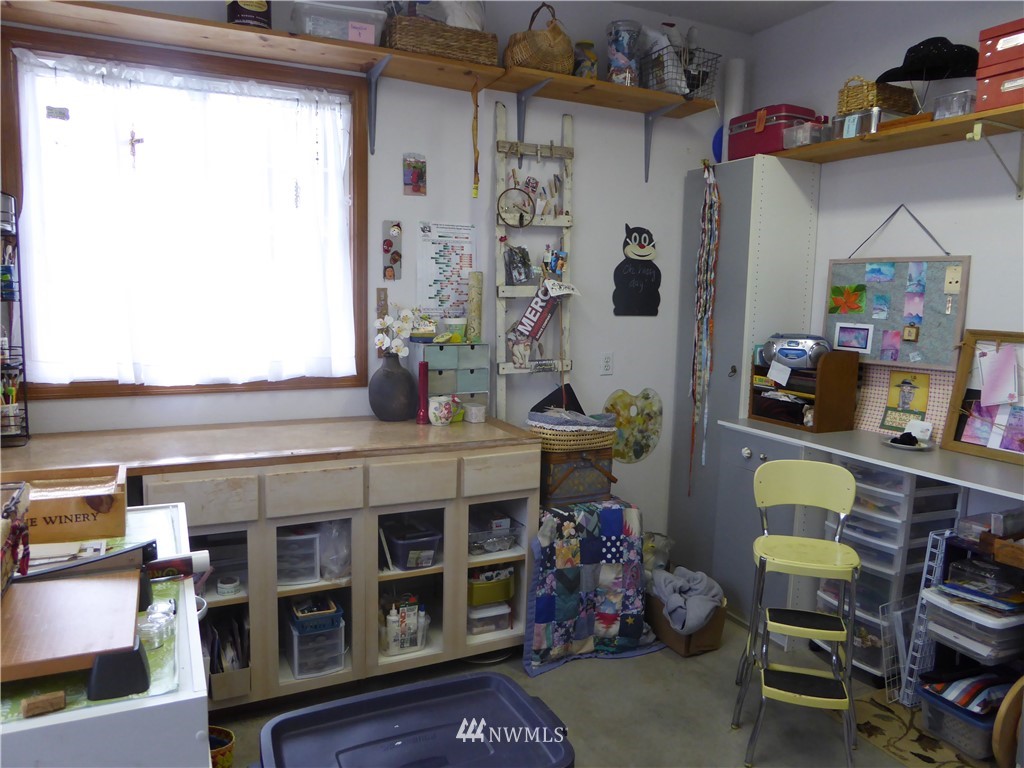 9527 Gastaeson Lane Southwest Rochester, WA 98579 - Photo 36 of 40 a room with furniture and a window