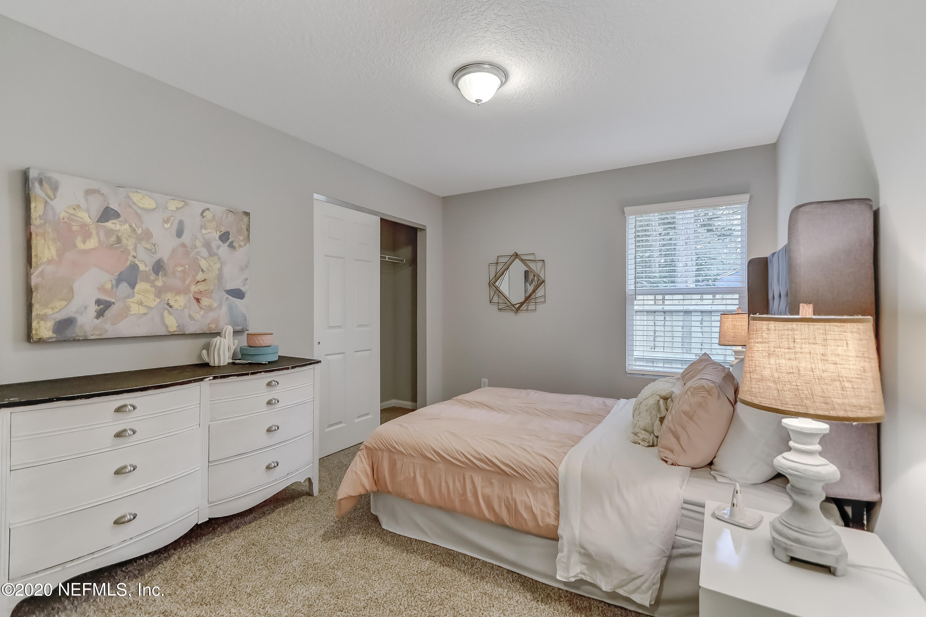 5422 Kennerly Road Jacksonville, FL 32207 - Photo 13 of 41 a bedroom with a bed and a painting on the wall