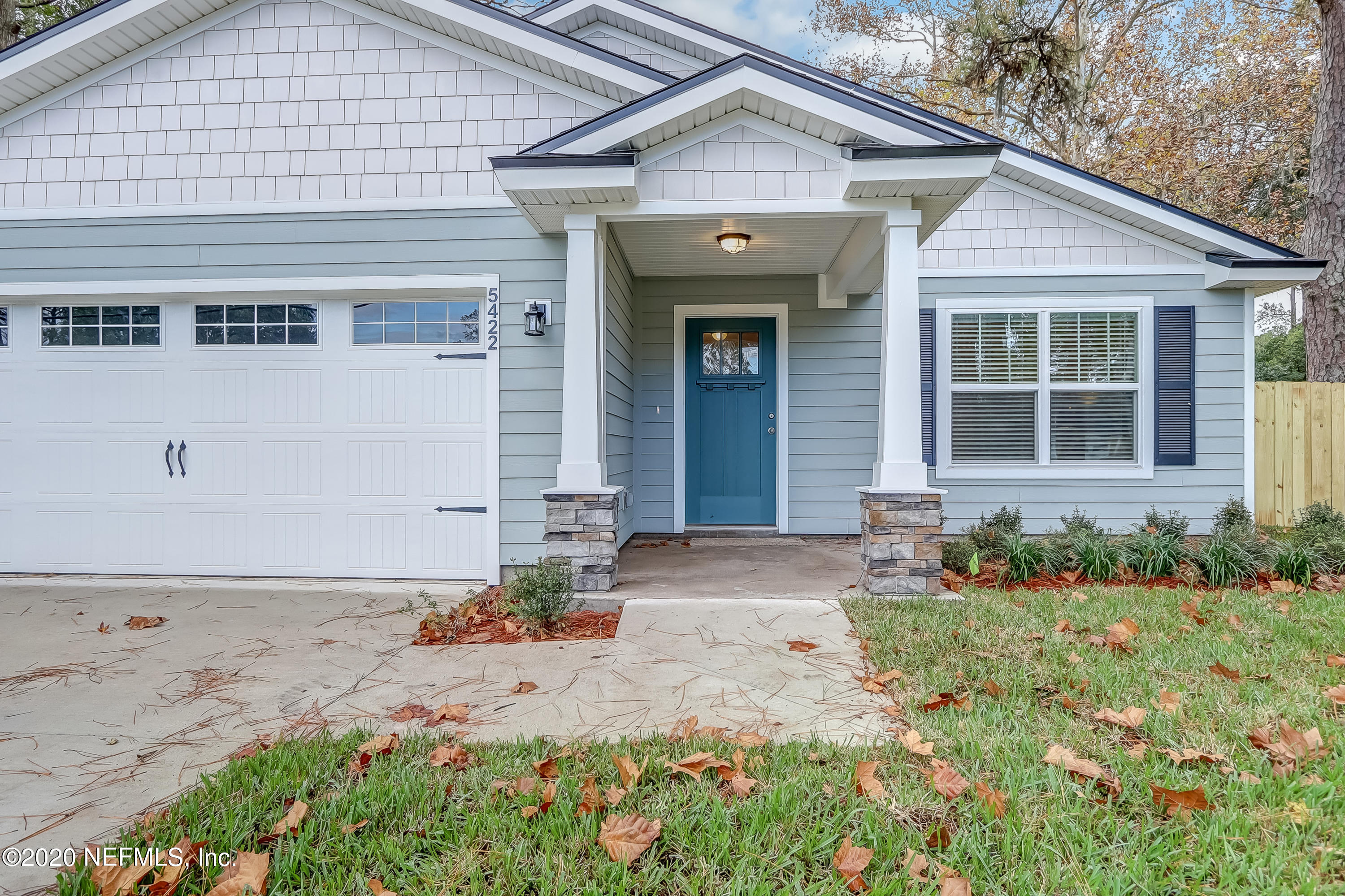 5422 Kennerly Road Jacksonville, FL 32207 - Photo 2 of 41 a front view of a house with a yard