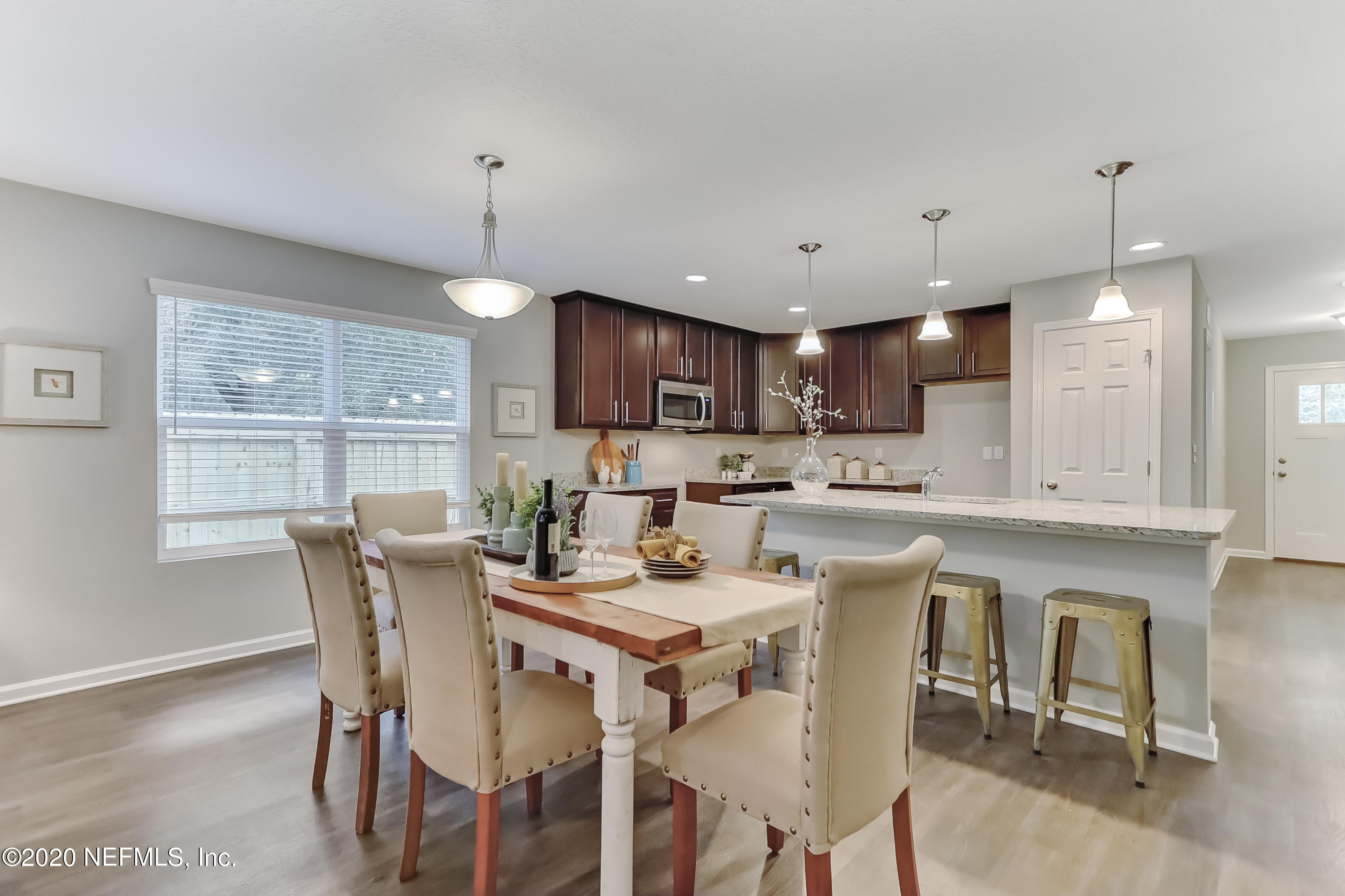 5422 Kennerly Road Jacksonville, FL 32207 - Photo 24 of 41 a view of a dining room with furniture window and wooden floor