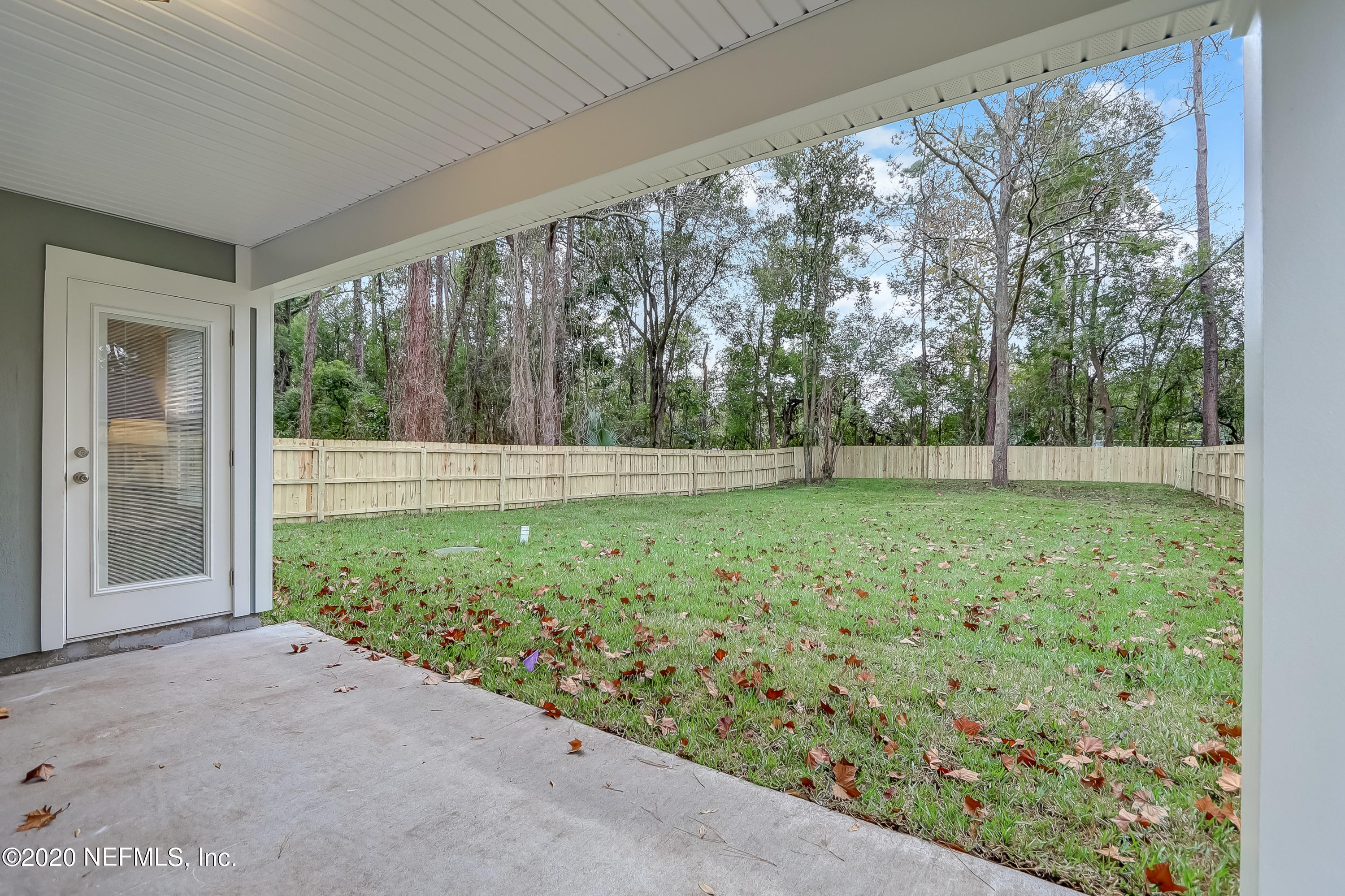 5422 Kennerly Road Jacksonville, FL 32207 - Photo 35 of 41 a view of a yard with porch and wooden fence