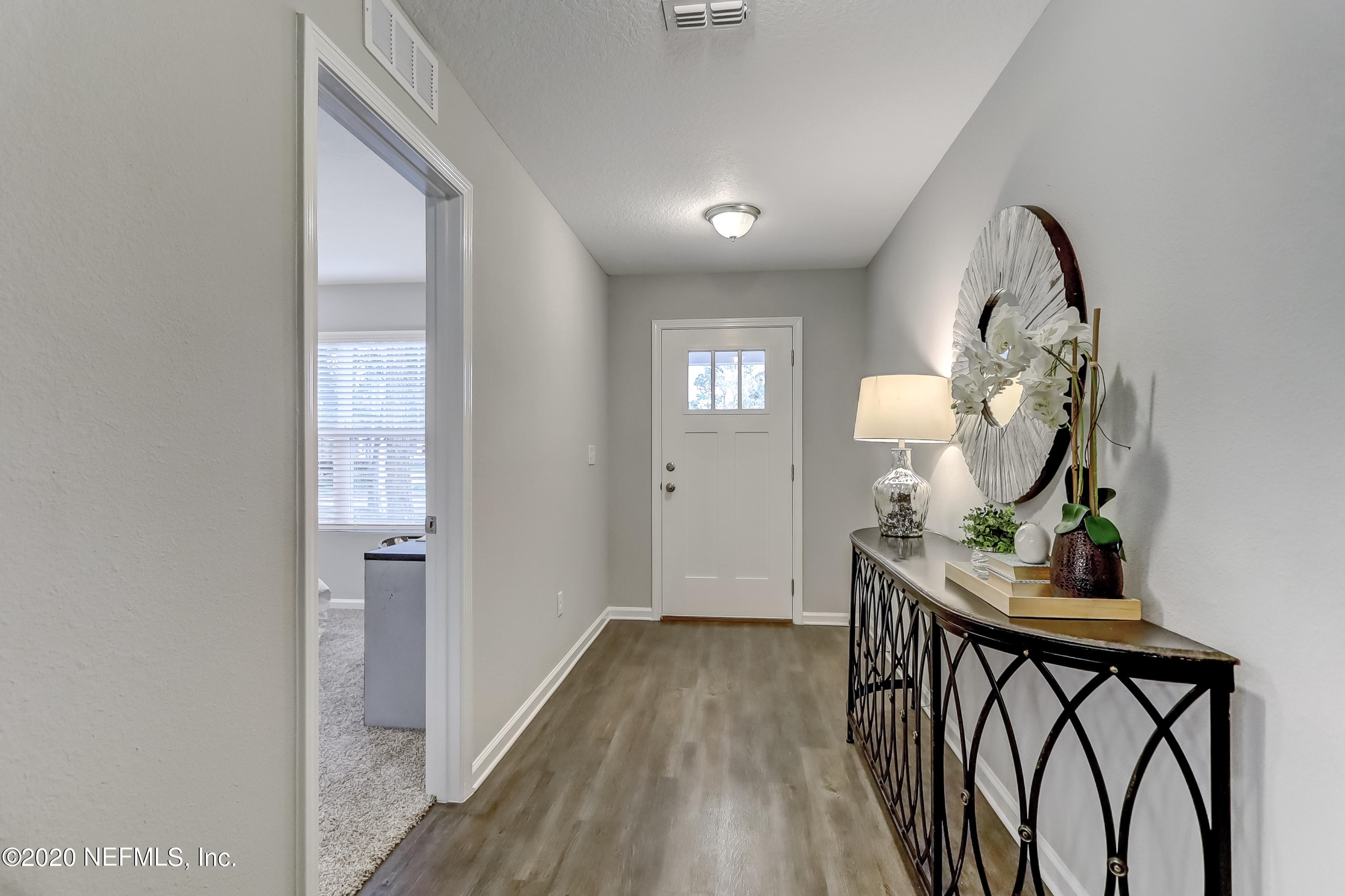 5422 Kennerly Road Jacksonville, FL 32207 - Photo 4 of 41 a view of a hallway and wooden floor windows