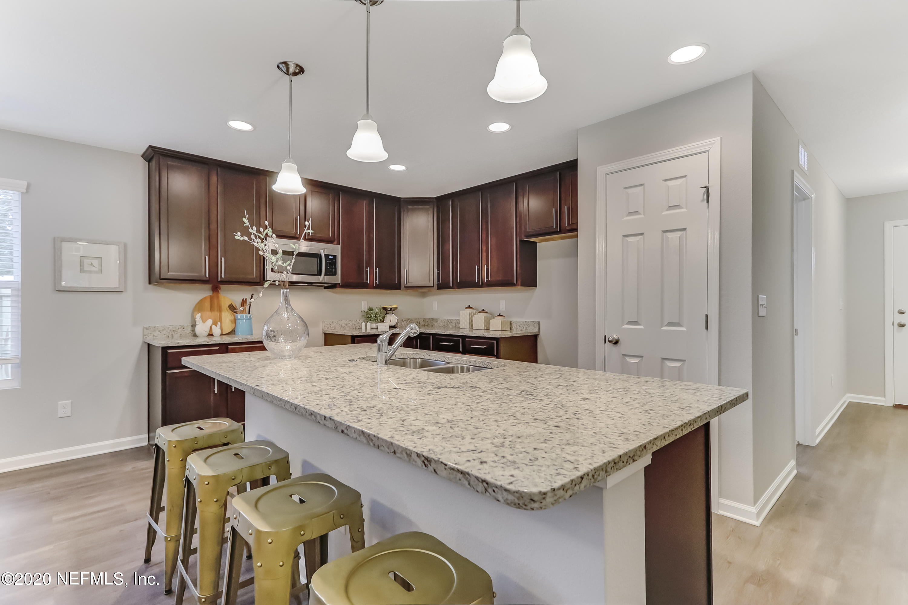 5422 Kennerly Road Jacksonville, FL 32207 - Photo 8 of 41 a kitchen with stainless steel appliances granite countertop a sink refrigerator and cabinets