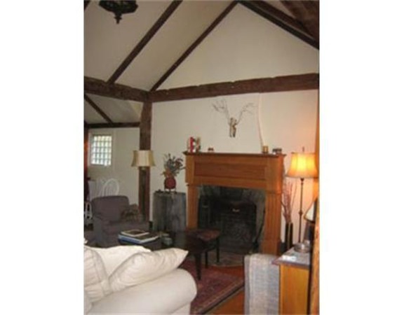 15 Hillside Road Gloucester, MA 01930 - Photo 5 of 10 a living room with furniture and a fireplace