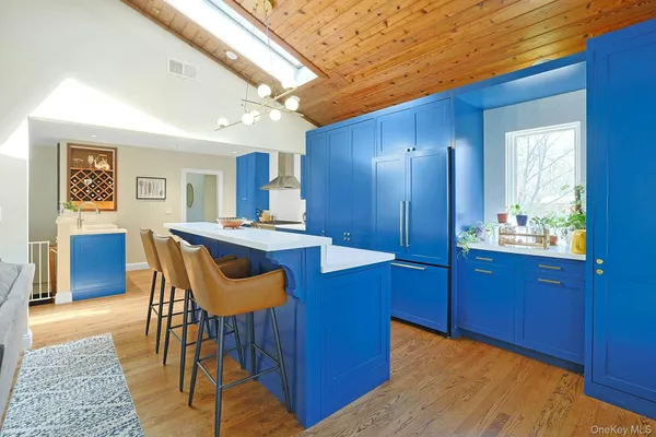 a spacious bedroom with a bed and a cabinets