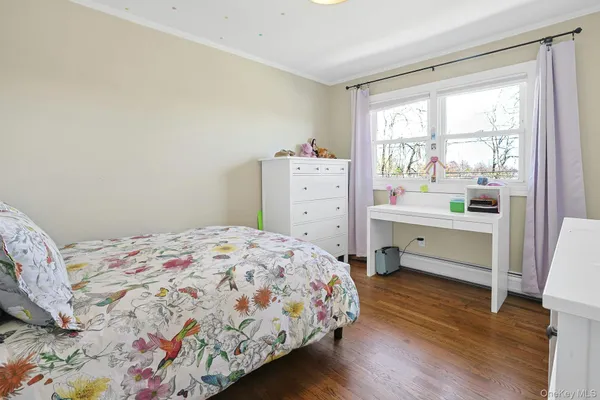 a living room with furniture a rug and a large window