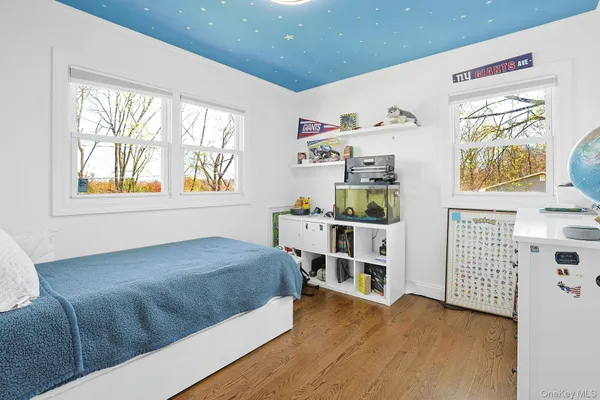 a view of a house with a yard and sitting area