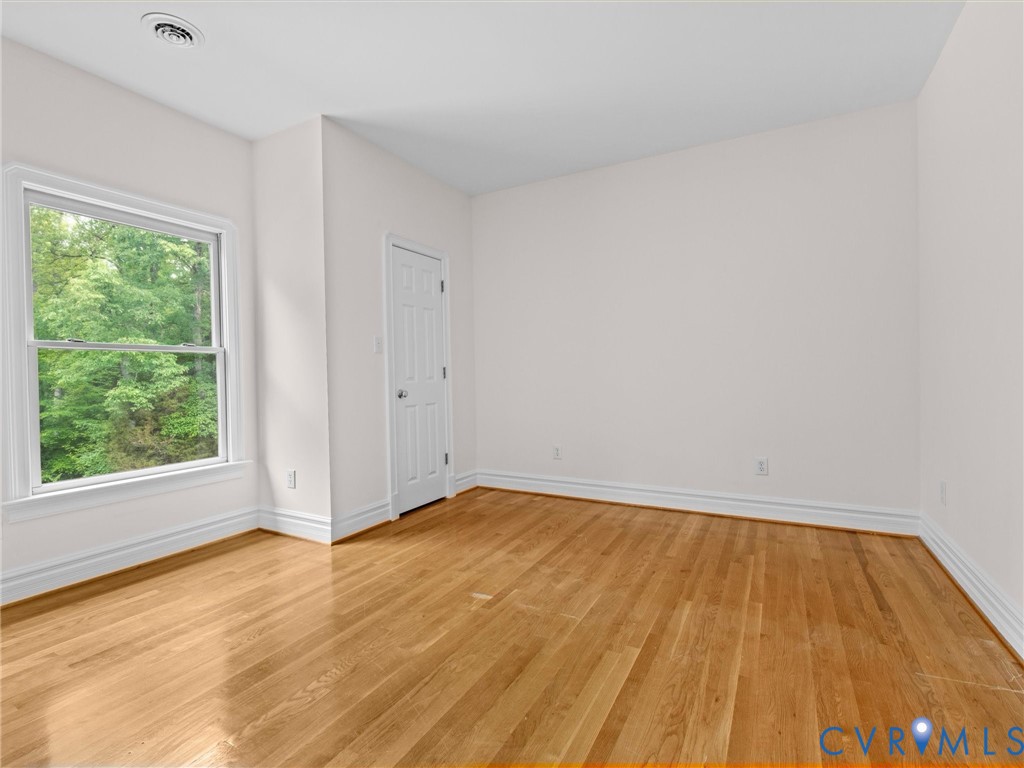 1700 Tigers Road Manakin-Sabot, VA 23103 - Photo 43 of 64 a view of empty room with wooden floor and fan