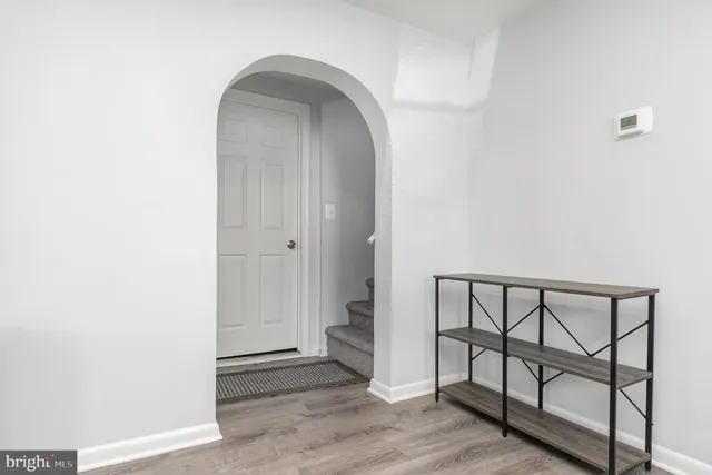 a view of a bedroom with workspace and a window
