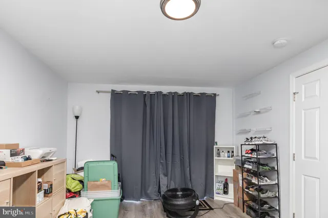 an view of hallway with wooden floor