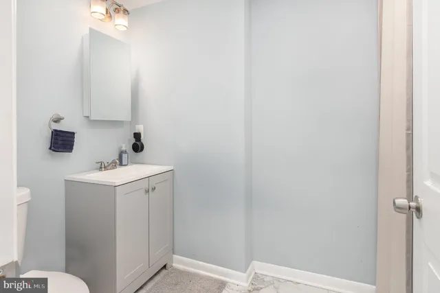 a view of a house with a wooden deck