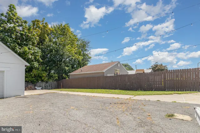 a view of a house with a wooden deck