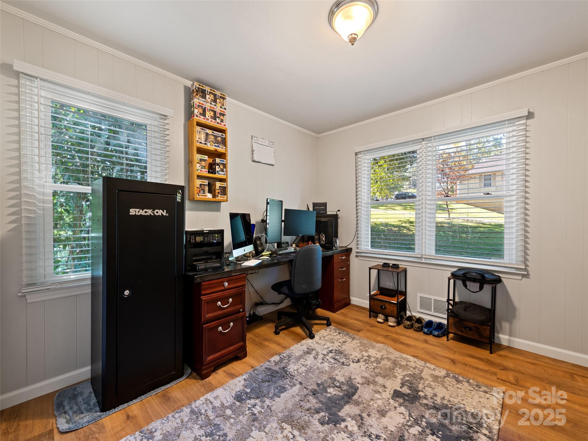 263 Blanton Street Columbus, NC 28722 - Photo 28 of 45 a view of a workspace with furniture and a window