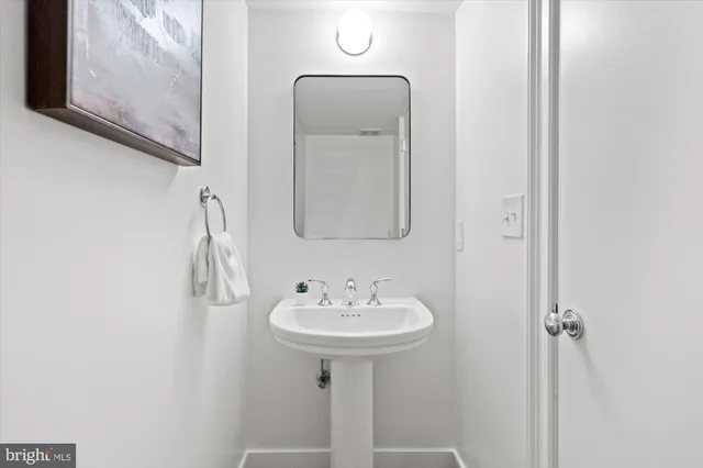 a bathroom with a sink a mirror and vanity