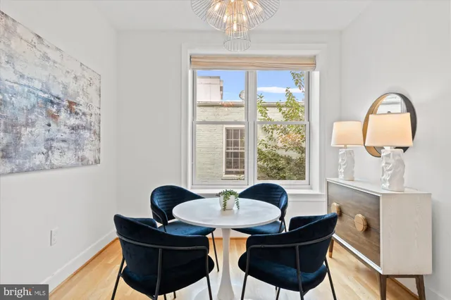 a dining room with furniture and window