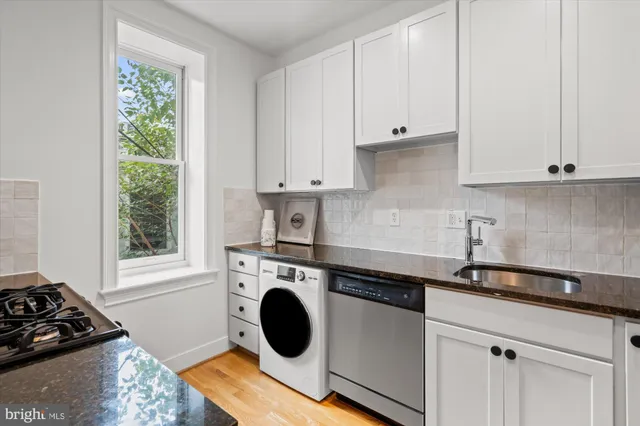a kitchen with a stove and a sink