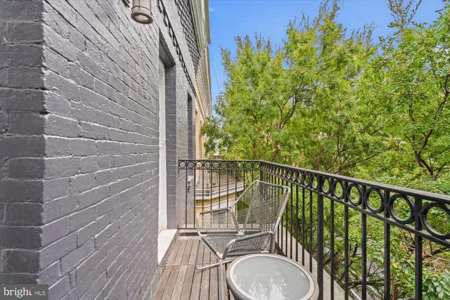 a balcony with wooden floor