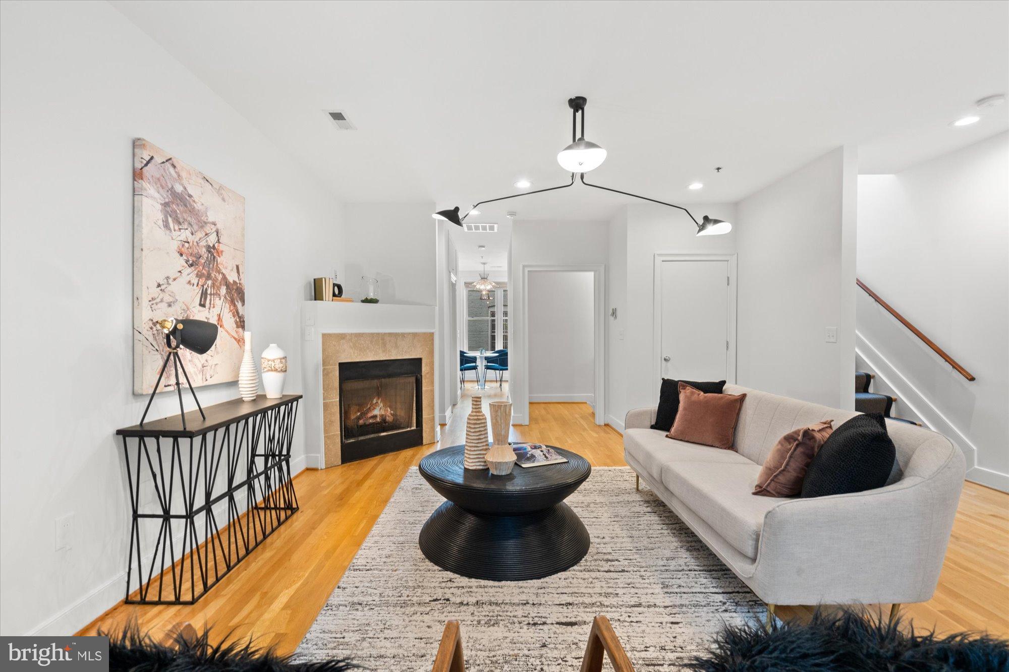 2145 N Street Northwest, Unit 3 Washington, DC 20037 - Photo 4 of 36 a living room with furniture and a fireplace