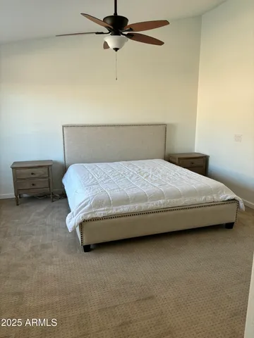 a bedroom with a bed and a dresser