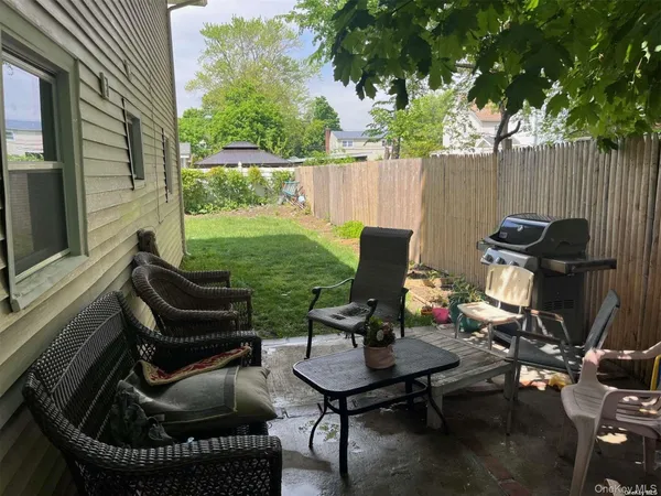 a view of a yard with furniture