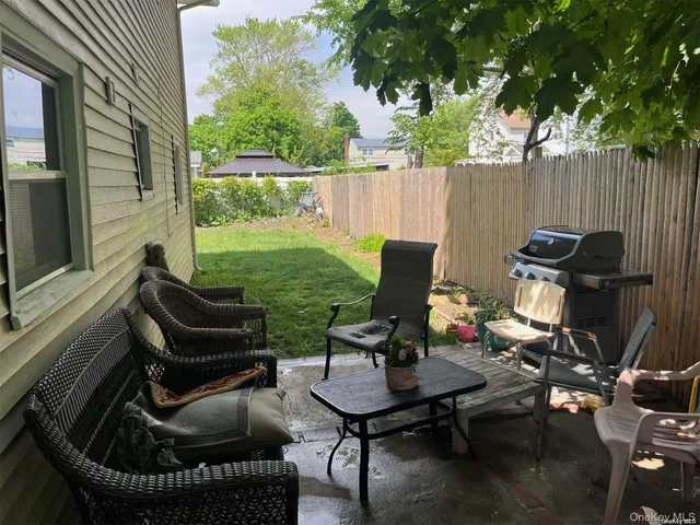 a view of a yard with furniture