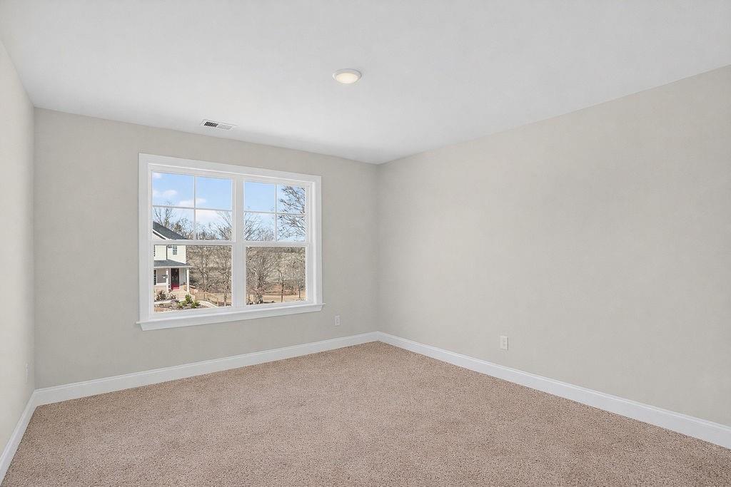152 Classic Overlook Homer, GA 30547 - Photo 16 of 36 an empty room with a window
