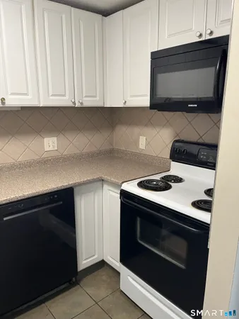 a kitchen with a stove and a microwave