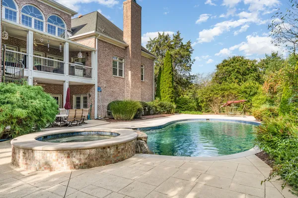 a view of a swimming pool with a garden