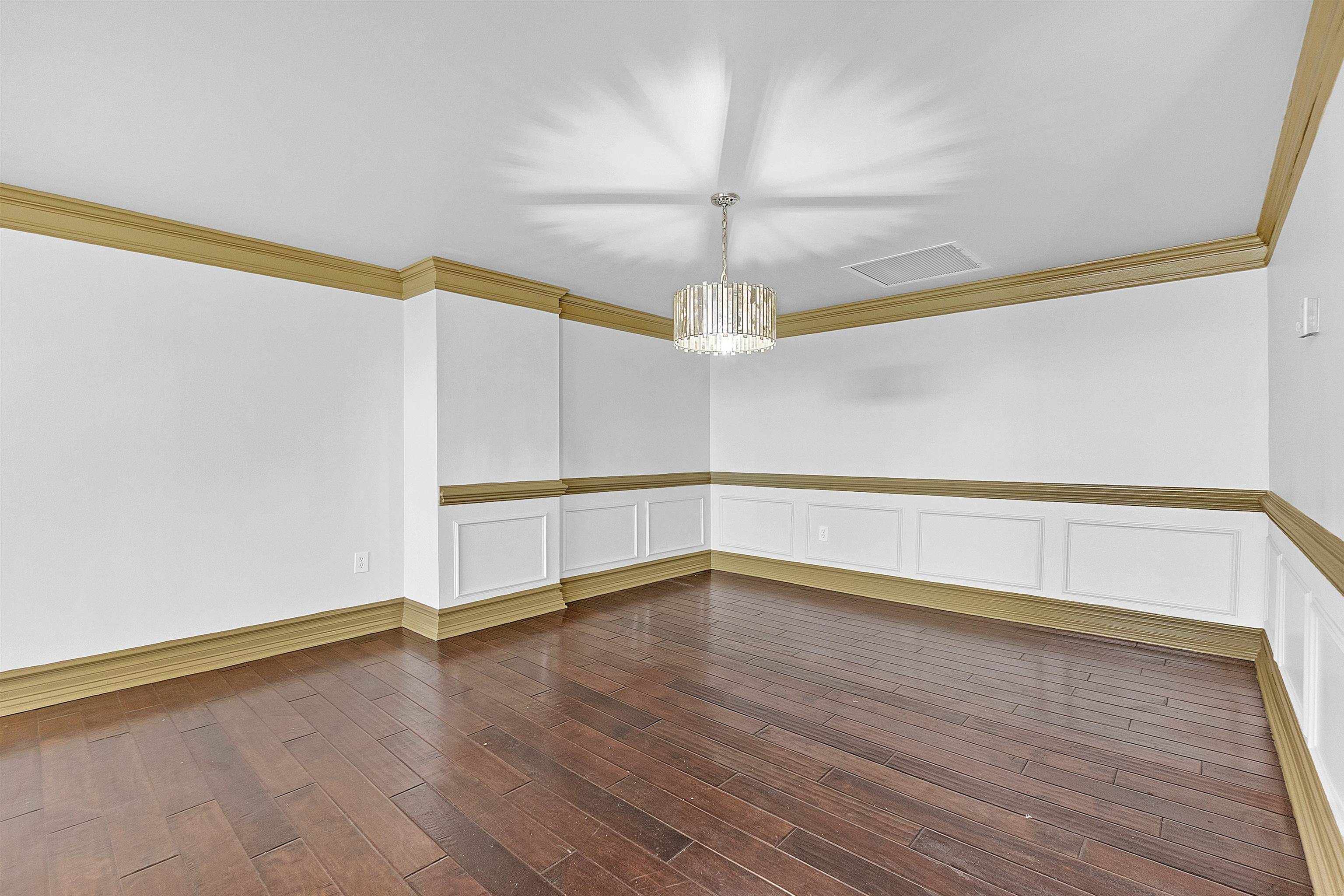 655 Riverside Drive, Unit 206 Memphis, TN 38103 - Photo 13 of 28 a view of an empty room with wooden floor