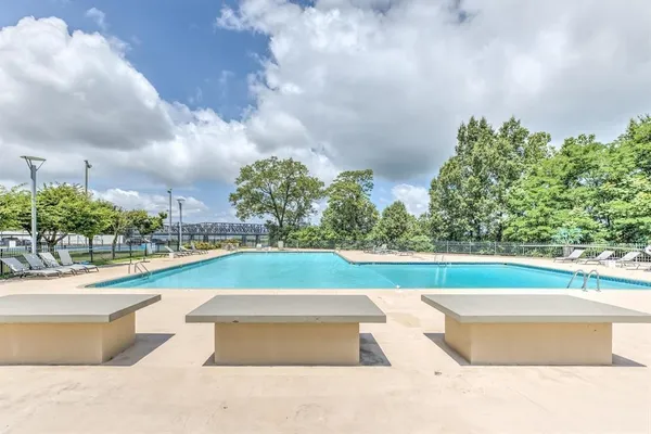 a view of swimming pool with outdoor space and seating area